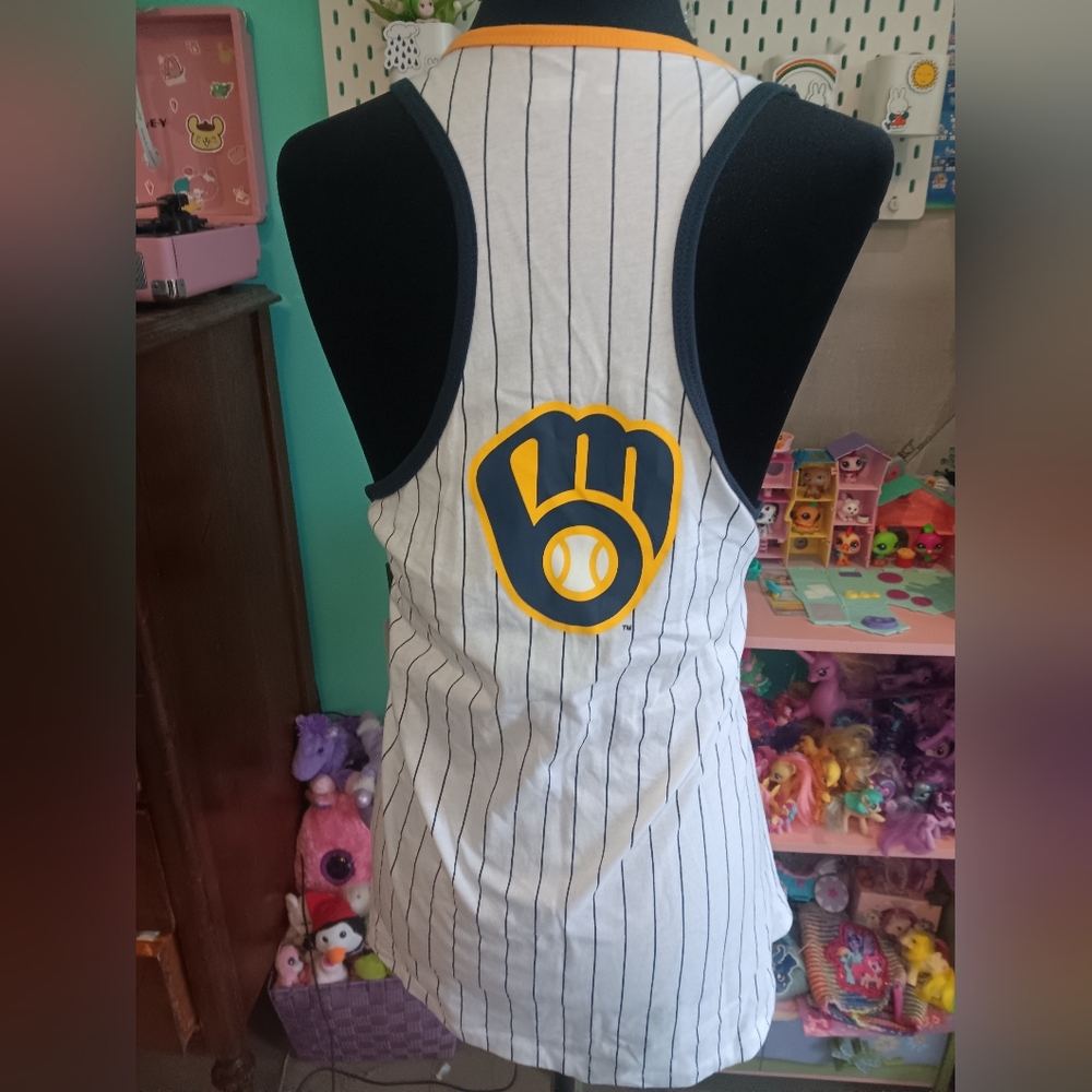 New White Pinstripe Tank With Yellow Trim And A Navy Brewers Logo.